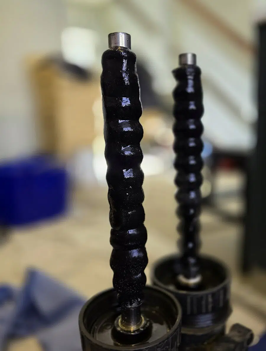 Magnetic filter magnet covered in black magnetite sludge removed during a power flush in Streatham, South London