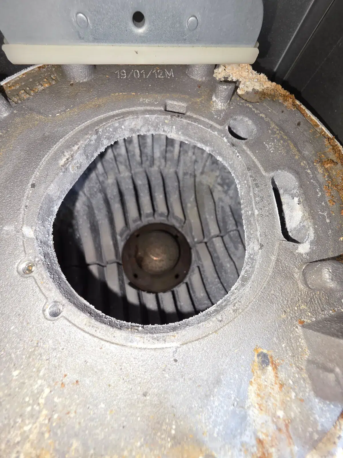 Heat exchanger being cleaned during the boiler service  by local gas engineer