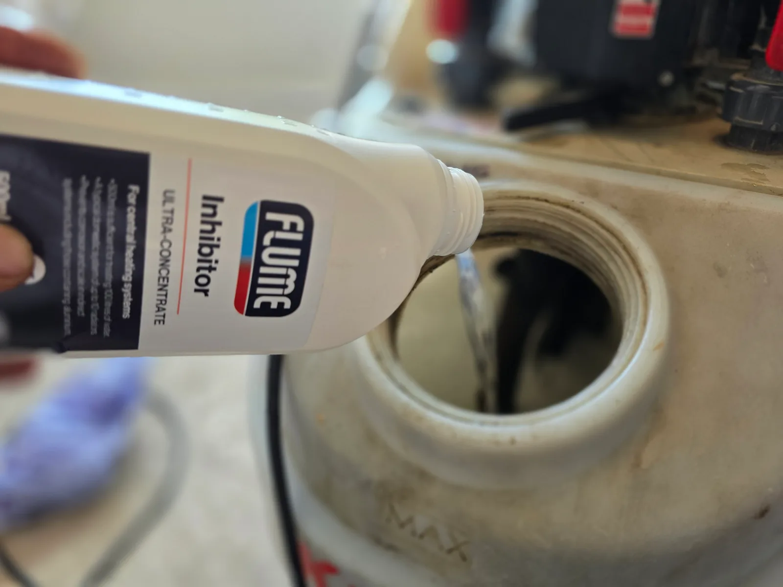 Flume inhibitor being added to the central heating system after the power flush