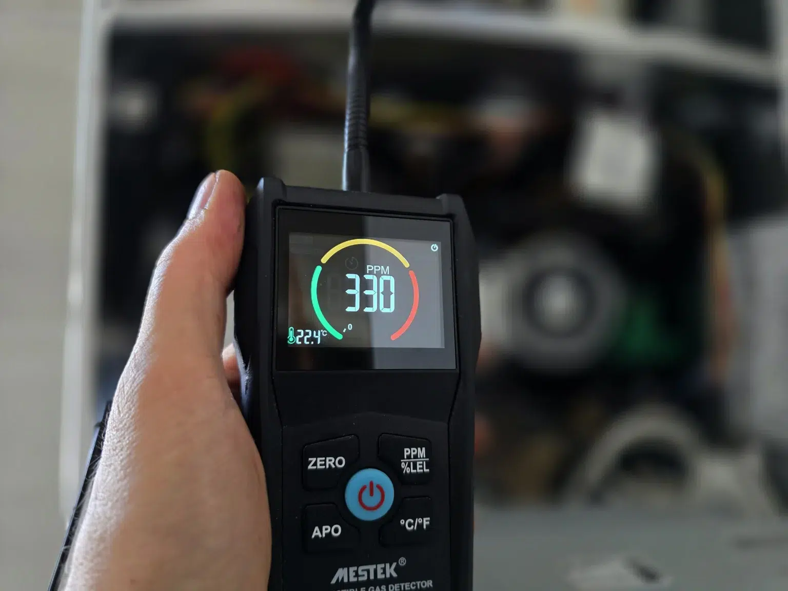 Gas leak detector in use during commercial gas leak detection and fault finding at a boiler in Fulham, West London